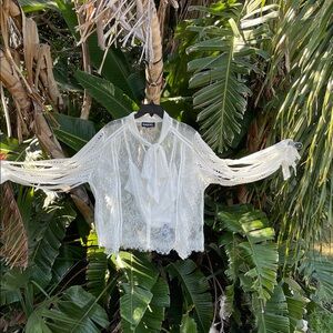 Unique sheer ruffled lace blouse with ribbon, statement sleeves,